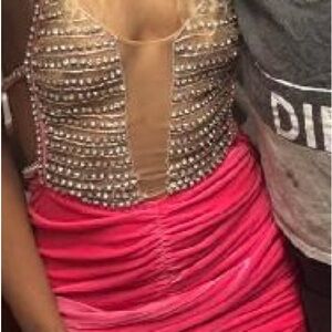 Pink exclusive dress with diamonds.Red 2piece outfits with silver diamonds on it